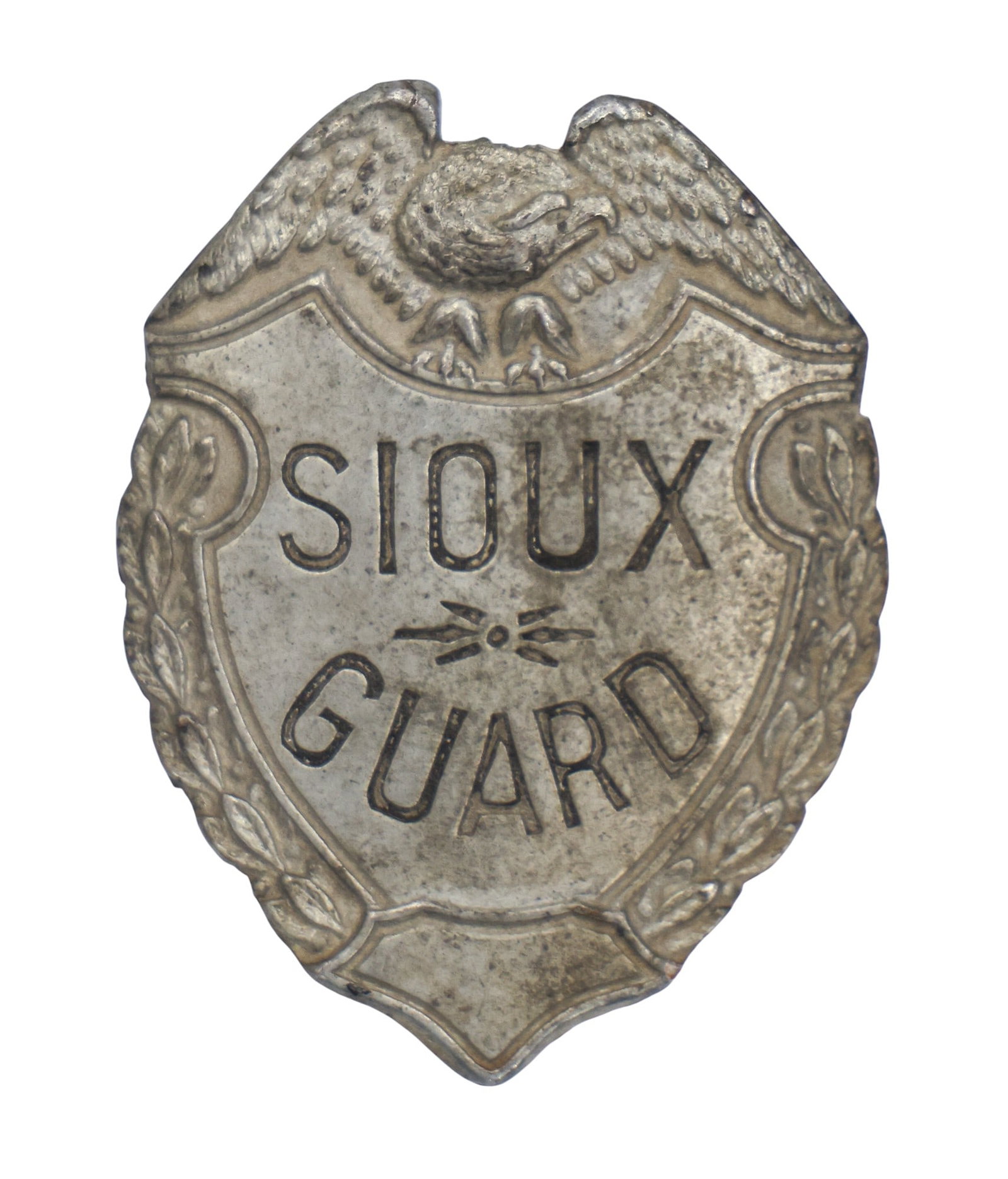 Antique Sioux Guard Metal Hat Badge: Antique Sioux Guard Metal Hat Badge 2.25"x1.75". On and old card stating it was purchased in South Dakota. Overall good condition for its age.