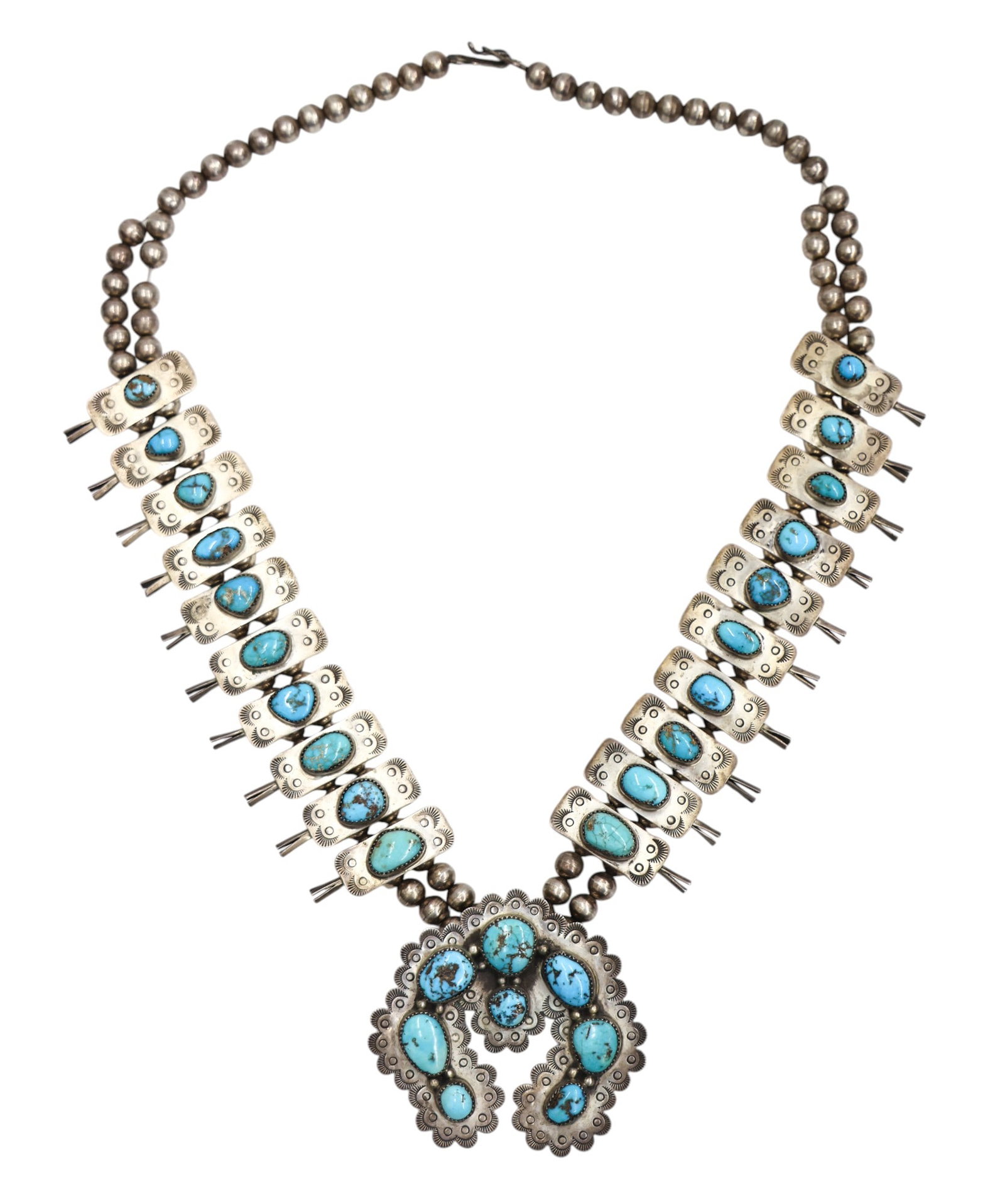 Old Navajo Sterling and Turquoise Squash Blossom Necklace: Old Navajo Sterling and Turquoise Squash Blossom Necklace 24". Includes turquoise cabochons measuring 7-16mm. Illegibly signed "P. Jamez" on verso. Overall excellent condition. It weighs. 183 grams.