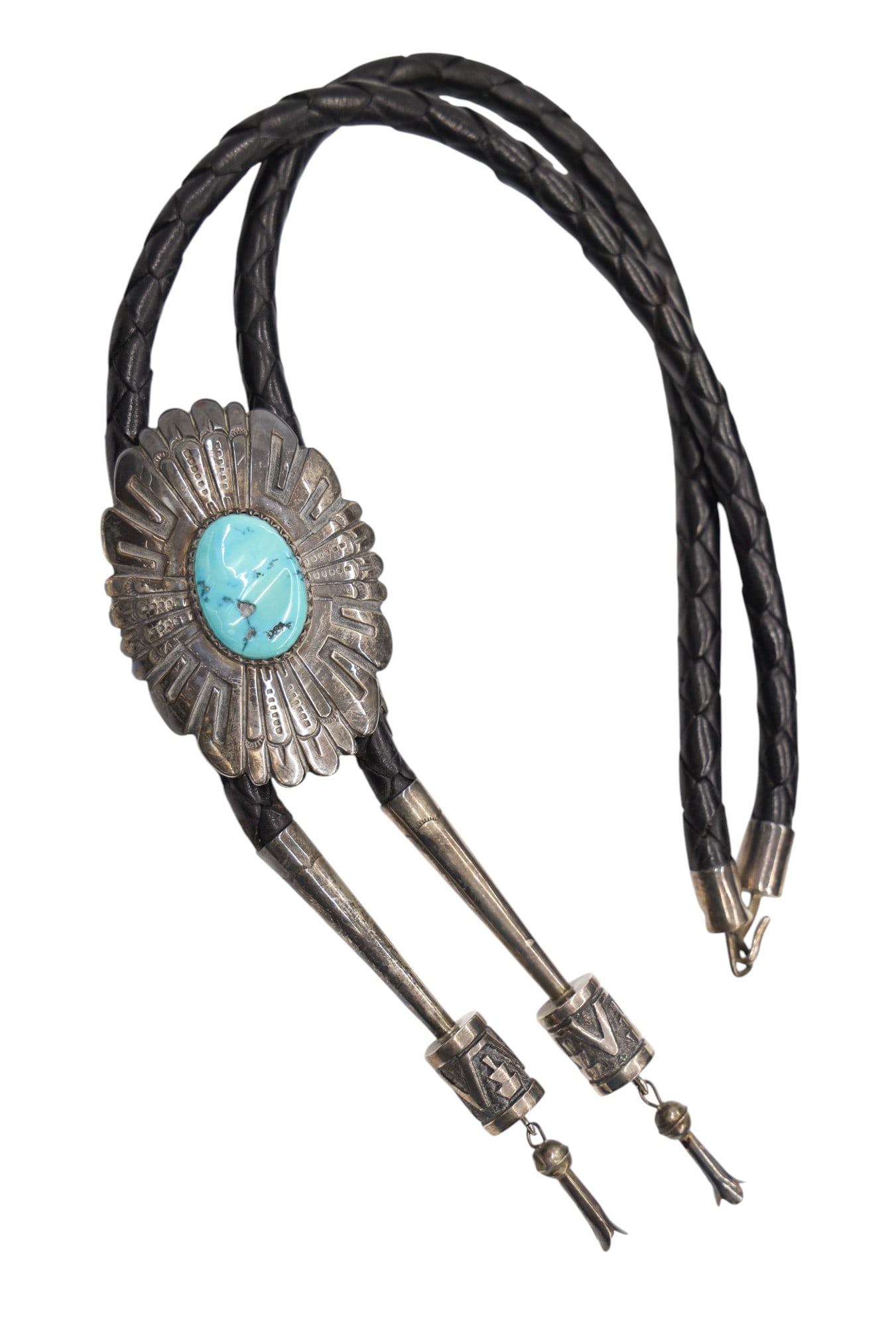 Thomas Singer Navajo Sterling and Turquoise Bolo Tie: Thomas Singer Navajo Sterling and Turquoise Bolo Tie 38". It has a 3" bolo slide with turquoise cabochon measuring 27mm. Signed on verso. It weighs 125 grams total. Excellent condition.