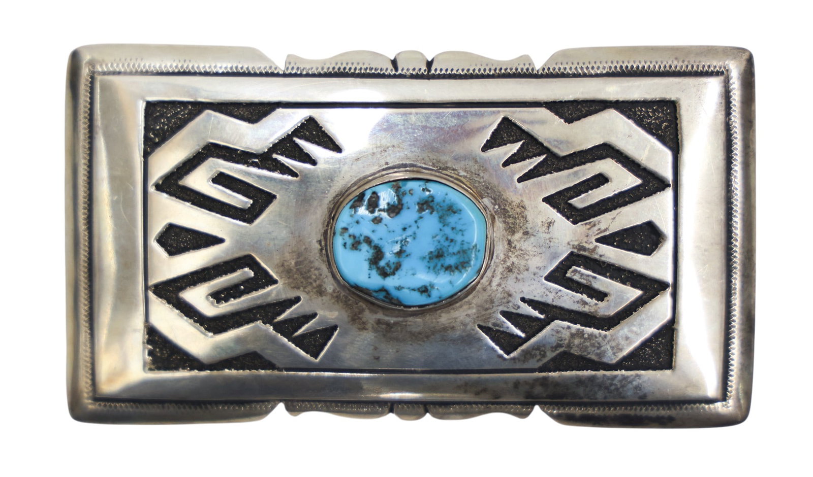 Tommy Singer Navajo Sterling and Turquoise Belt Buckle: Tommy Singer Navajo Sterling and Turquoise Belt Buckle 3.5". Set with a natural cabochon measuring 19mm. Signed on verso. It weighs 61 grams. Excellent condition.