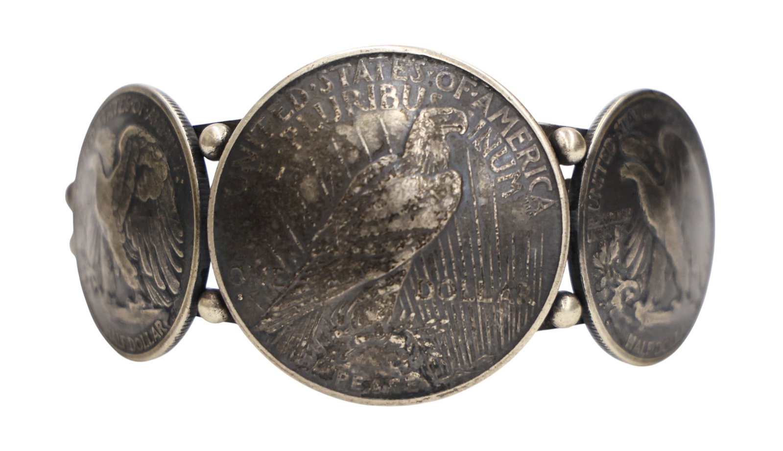 Navajo Buffalo Dancer US Silver Coin Sterling Cuff Bracelet: Navajo Buffalo Dancer US Silver Coin Sterling Cuff Bracelet Fits 7" Wrist. Set with a 1926 Peace dollar and two 1940's Walking Liberty half dollars. Marked on verso. It weighs 75 grams. Excellent