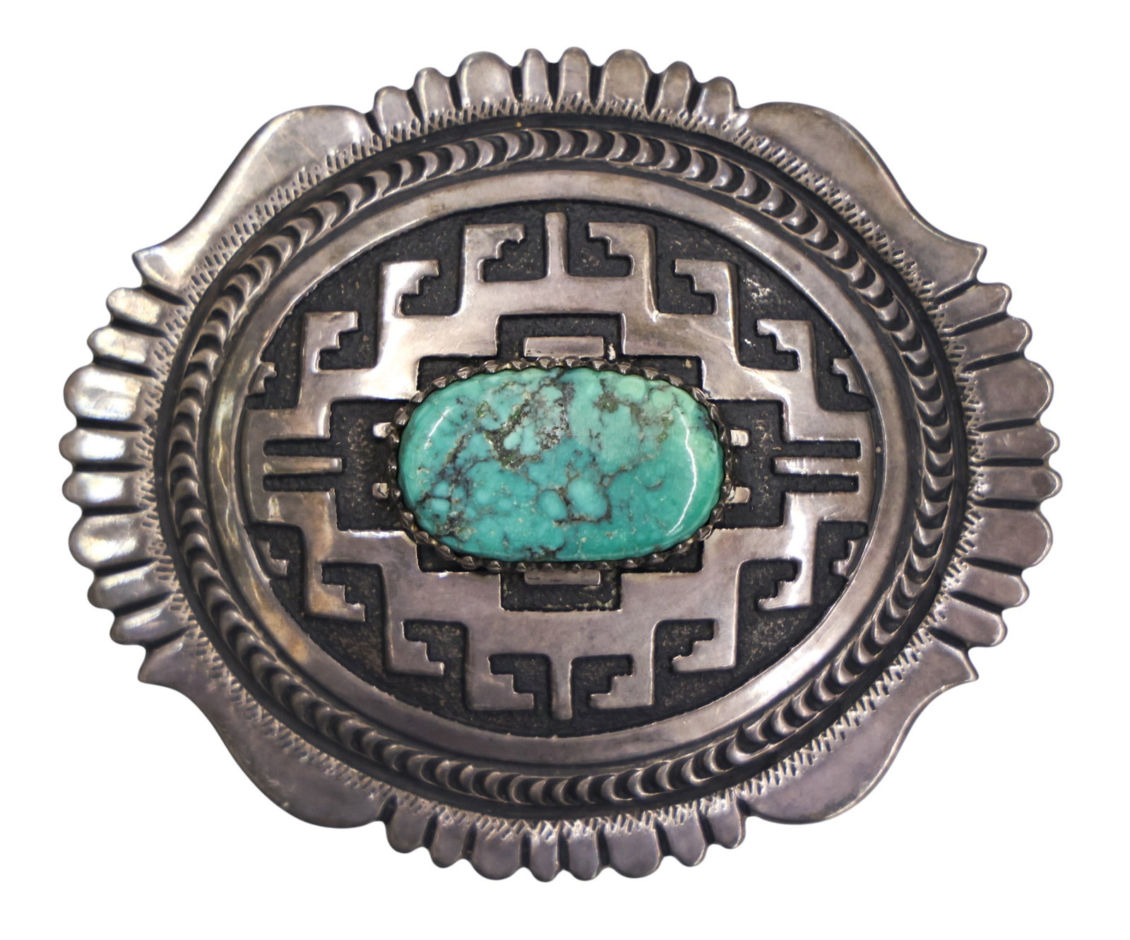 Tommy Singer Navajo Sterling and Turquoise Buckle: Tommy Singer Navajo Sterling and Turquoise Buckle 3"x3.75". Set with a turquoise cabochon measuring 29mm. Signed on verso. It weighs 88 grams. Overall excellent condition.