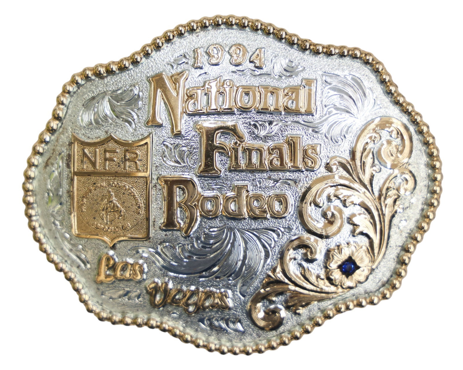 1994 National Finals Rodeo Las Vegas 22k Plated Belt Buckle: 1994 National Finals Rodeo Las Vegas 22k Plated Belt Buckle 3.5"x4.5". Limited edition numbered #2,903 of 5,000. Unused in its original box, manufactured by Gary Gist Inc.