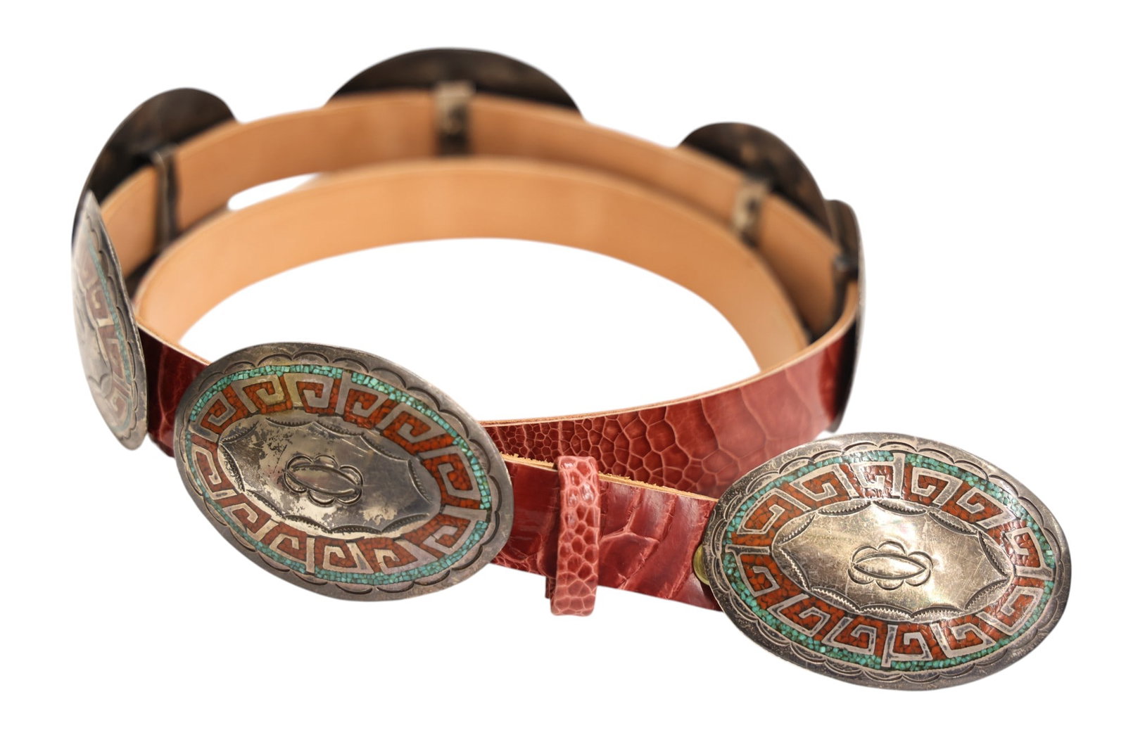 Old Navajo Silver Inlaid Turquoise and Coral Concho Belt: Old Navajo Silver Inlaid Turquoise and Coral Concho Belt 48". Seven piece set with buckle and (6) matching oval conchos measuring 3.25". Unsigned. It weighs 361 grams. Scattered scratching from use.
