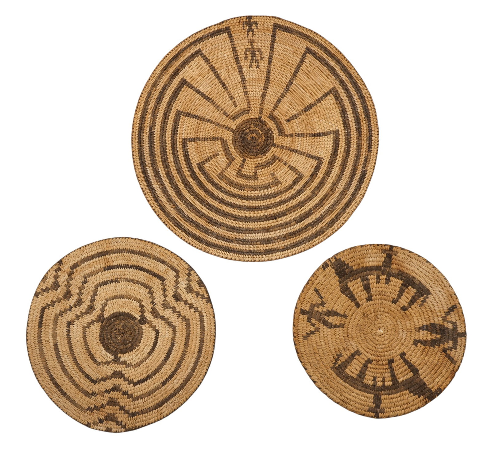 3pc Antique Pima Indian Basket Round Plaques: 3pc Antique Pima Indian Basket Round Plaques 9" to 13.5". Pictorial baskets including Man in the Maze and animal motifs. Holes in center from hanging and some staining. Overall good condition for