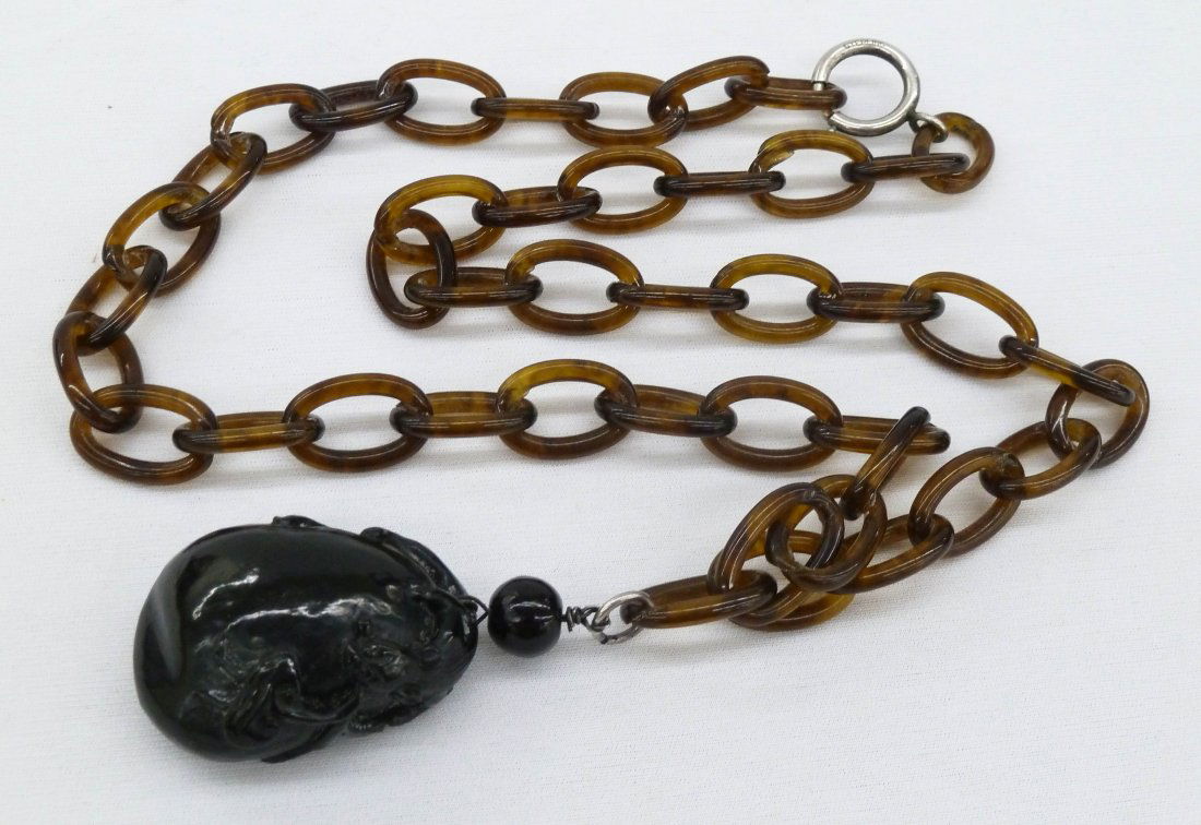 Chinese Carved Tortoise Shell Link & Pendant Necklace: Chinese Carved Tortoise Shell Link & Pendant Necklace with Kylin. Includes a 24'' link necklace with a 2'' carved tortoise shell kylin carved pendant.