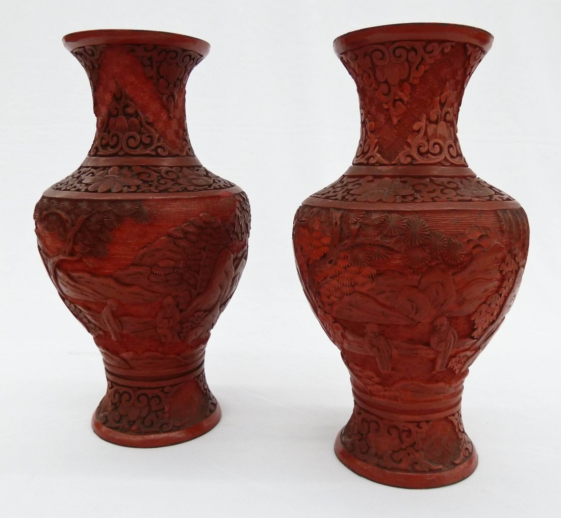 Pair of Antique Chinese Carved Cinnabar Figures in: Pair of Antique Chinese Carved Cinnabar Figures in Landscape Vases 8.25'' Each. Paper label on the bottom of each. Estate of R.V. Hill.