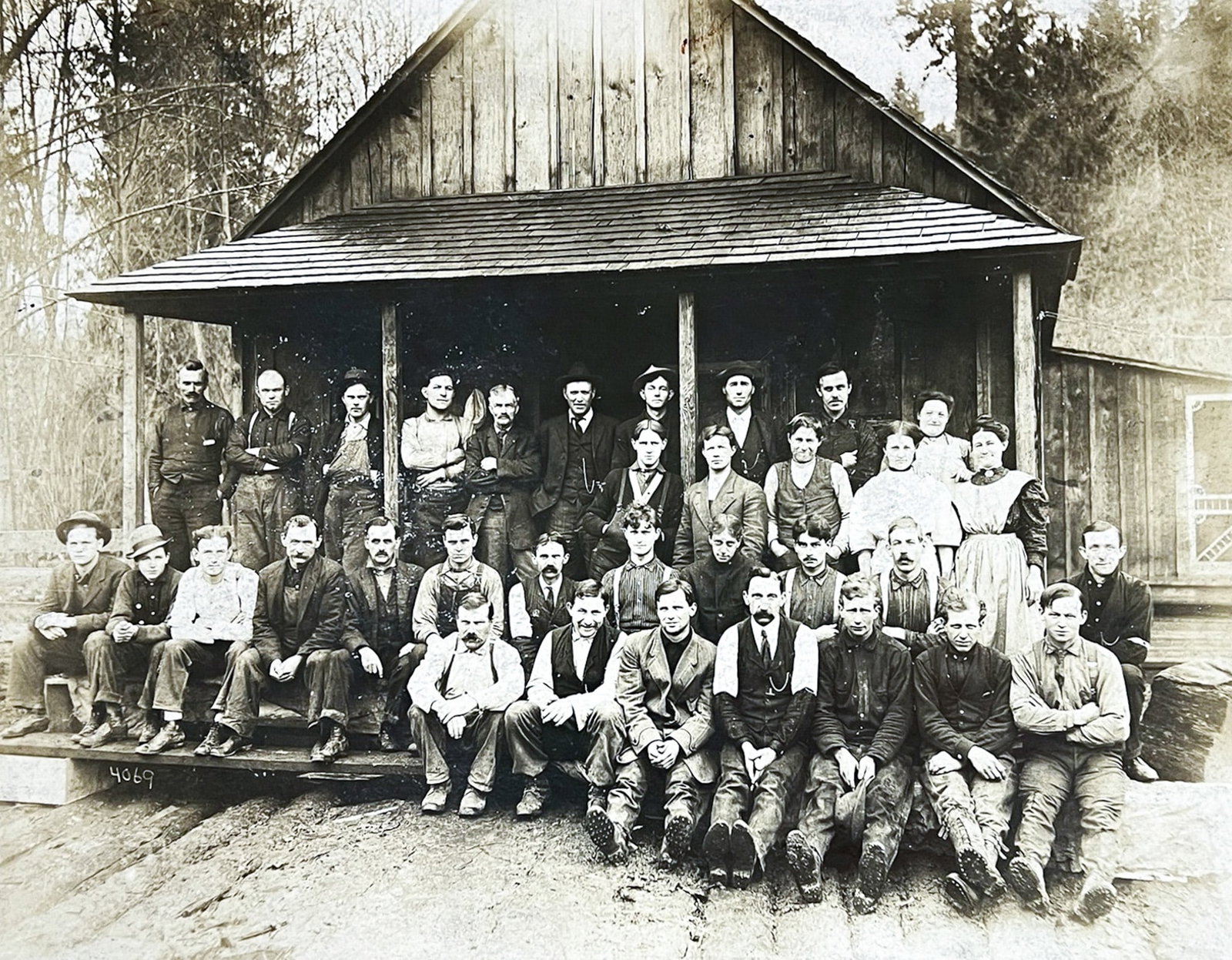 Darius Kinsey "Group Photo" Albumen Photograph: Darius Kinsey (1869-1945 Washington) "Group Photo" Albumen Photograph 11"x13.5" Photo 13"x17" Matted. Numbered 4069. Small tear to upper left of photograph, mat damaged.