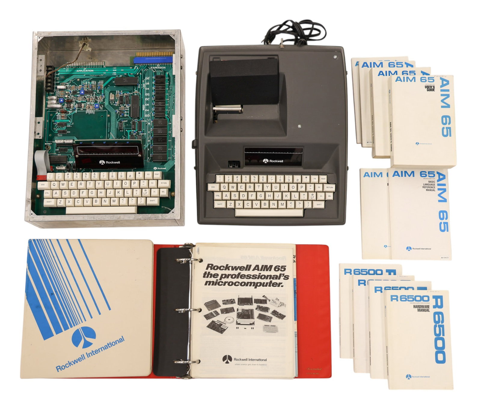 2pc 1970's Rockwell AIM-65 R6500 Microcomputers with Manuals: 2pc 1970's Rockwell AIM-65 R6500 Microcomputers with Manuals. Comes with ten manuals and two binders. Also Cognivox, clock, and Dual Acia Boards. Untested. As-seen condition.