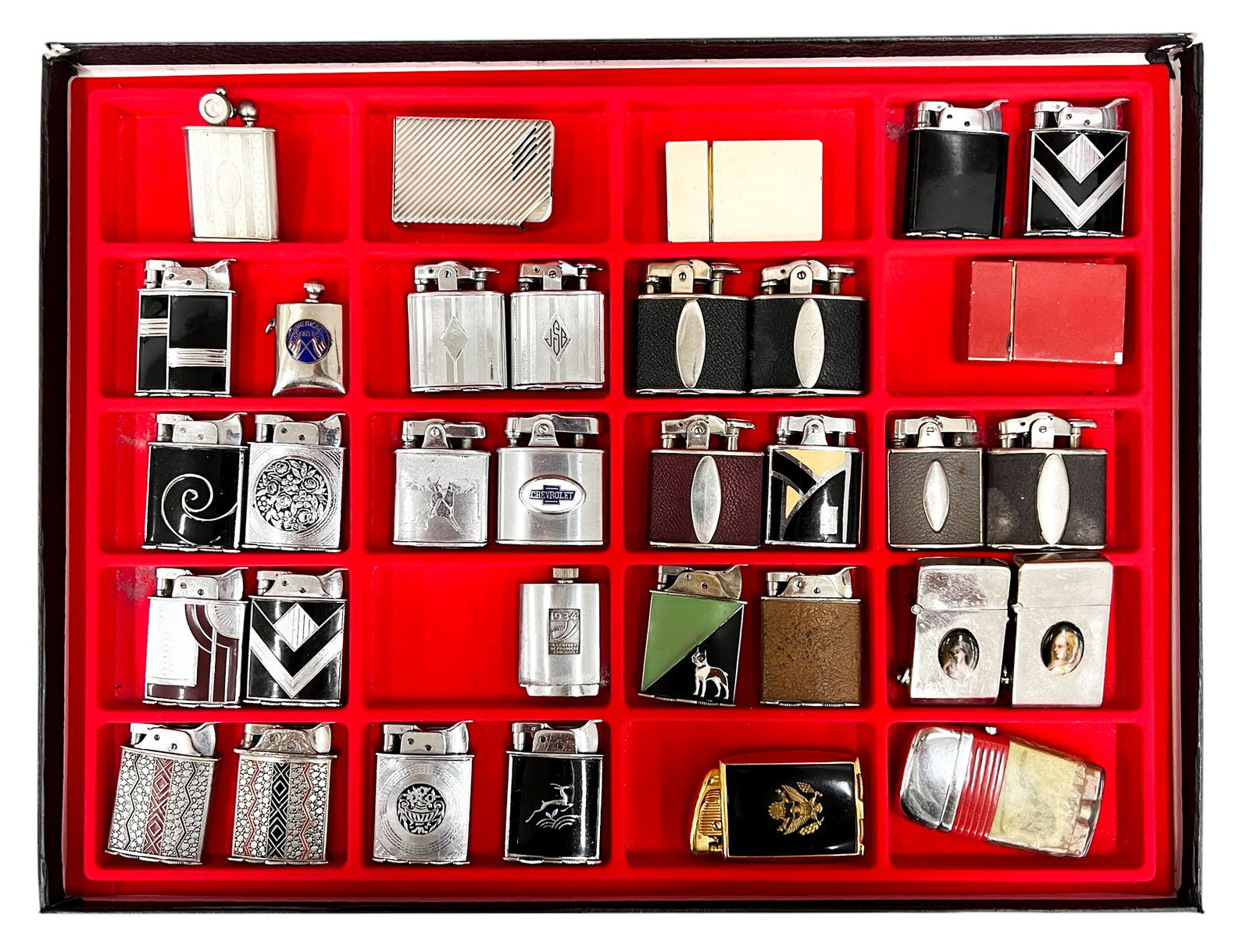 33pc Vintage Lighters w Display Box: 33pc Vintage Lighters w Display Box 2.25"x1.75" Largest. Includes patriotism, enameled portraits lighters. Brands include Evans, Vu-Lighter, McLaughlin's, Ronson, Netop etc.