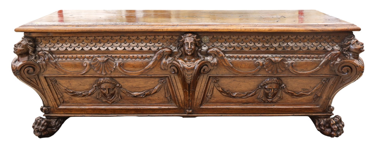 Italian 17th Cent. Baroque Carved Walnut Cassone: Italian 17th Cent. Baroque Carved Walnut Cassone 24"x66"x22". High relief carved winged figures with ball and claw feet. Some old scattered repairs and professional refinishing.