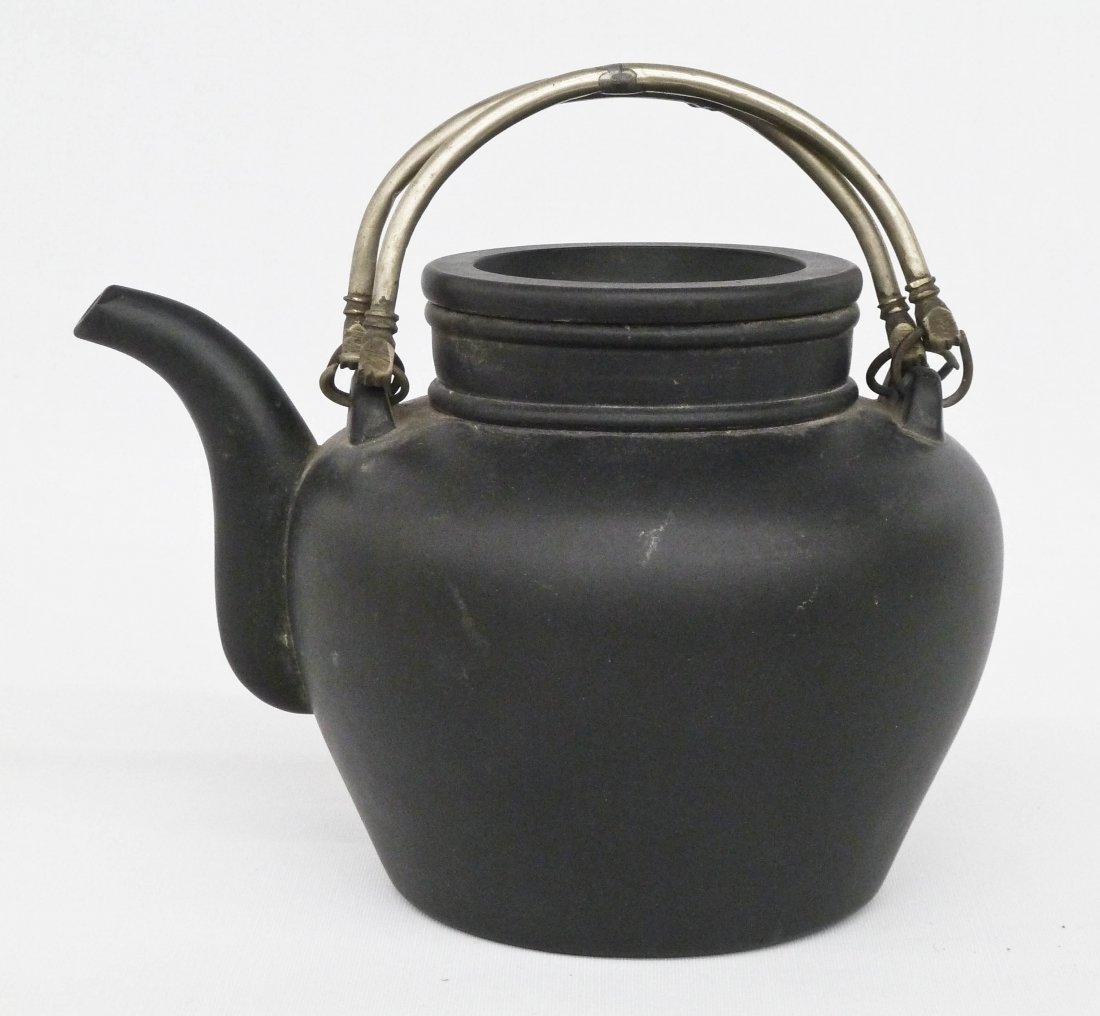 Antique Chinese Black Medium Yixing Clay Teapot: Antique Chinese Black Medium Yixing Clay Teapot 6.25''x8.5''. Original metal handles. Double gourd impressed mark on top of lid and stylized four character seal mark on bottom. No damage.