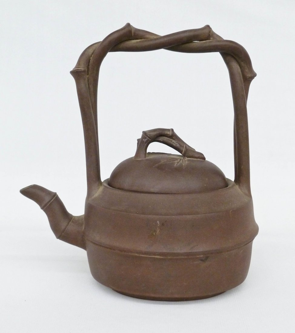 Chinese Yixing Clay Figural Handle Teapot: Chinese Yixing Clay Figural Handle Teapot 9.75''x8.75''. Red ink export mark on bottom. No damage.