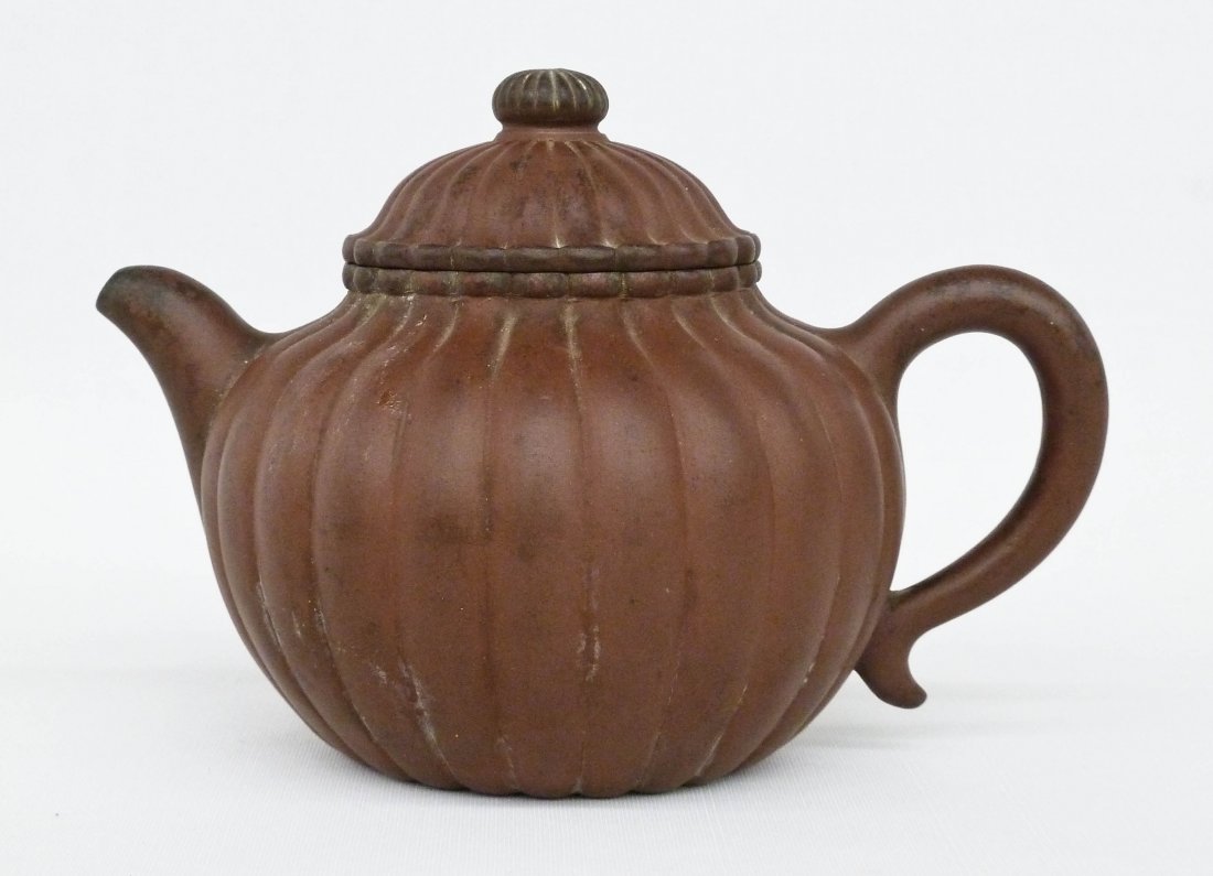 Antique Chinese Yixing Clay Lobed Teapot 5.75''x8''.: Antique Chinese Yixing Clay Lobed Teapot 5.75''x8''. Wax export seal on bottom. Small chip to rim of lid.