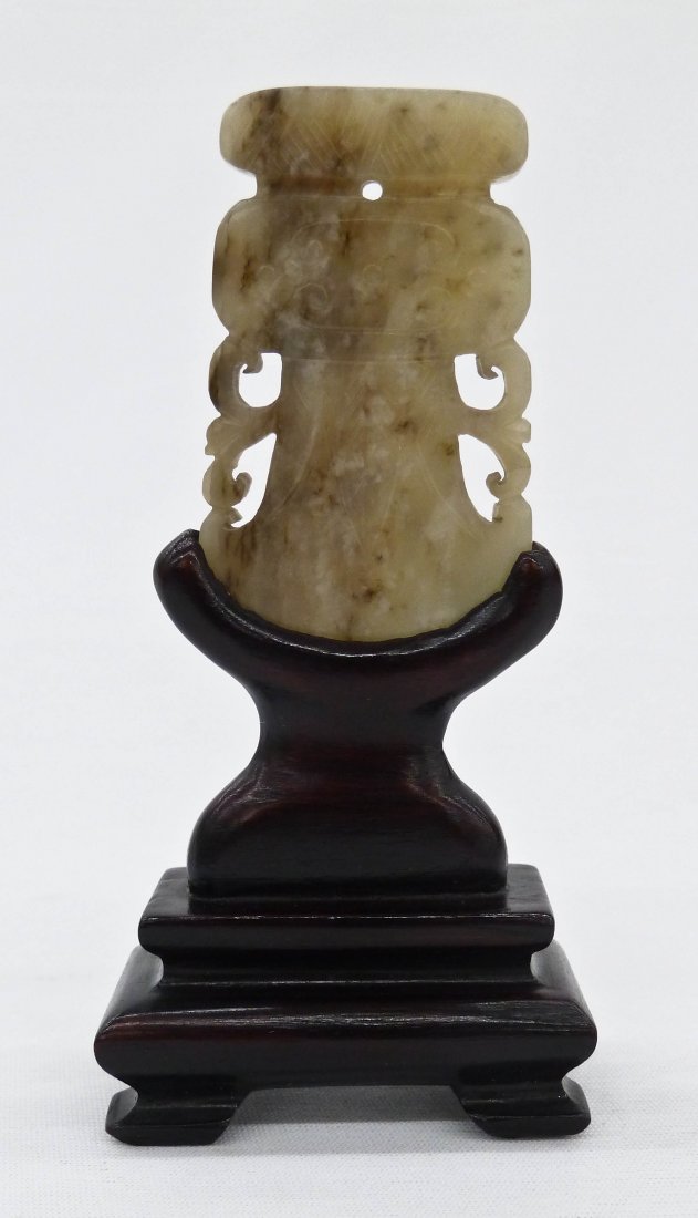Chinese Carved Jade Hatchet Pendant on Stand: Chinese Carved Jade Hatchet Pendant on Stand 4.25''x2''. Gray in color depicting an archaic style hatchet. Jade by itself measures 2.25''x1.5''.