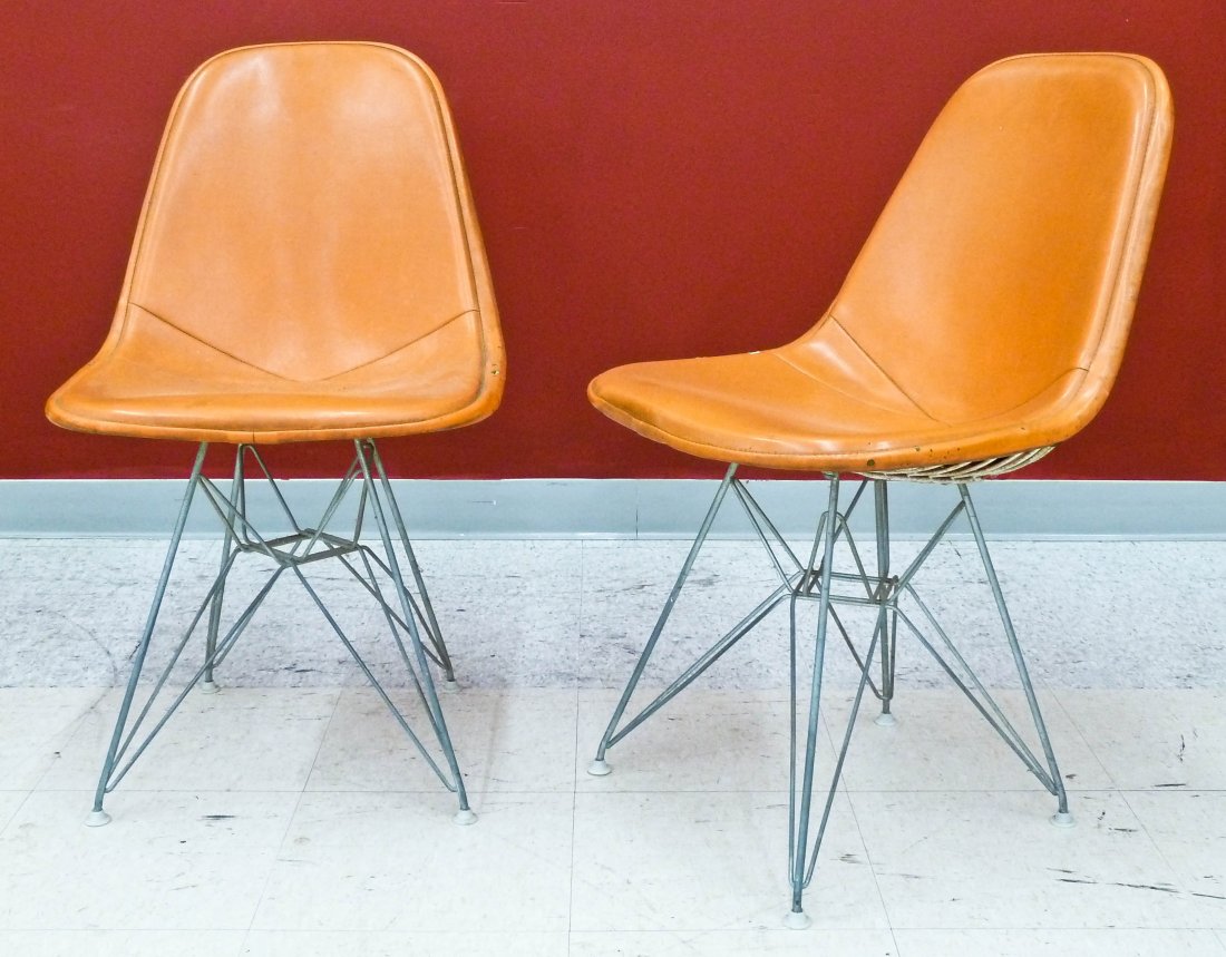 Pair Charles and Ray Eames for Herman Miller DKR Eiffel: Pair Charles and Ray Eames for Herman Miller DKR Eiffel Tower Chairs 32''x19''x22.5'' Each. Original vintage orange vinyl covers with cloth labels underneath. Overall wear and holes in vinyl.