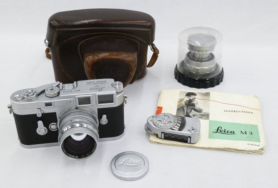 1959 Leica M3 Serial 959248 Camera Body with Summarit: 1959 Leica M3 Serial 959248 Camera Body with Summarit f=5cm 1:15 and Elmar f=9cm 1:4 Lenses. Outfit includes leather case and Leica meter. Camera is a clean example and in working order. No fungus or 