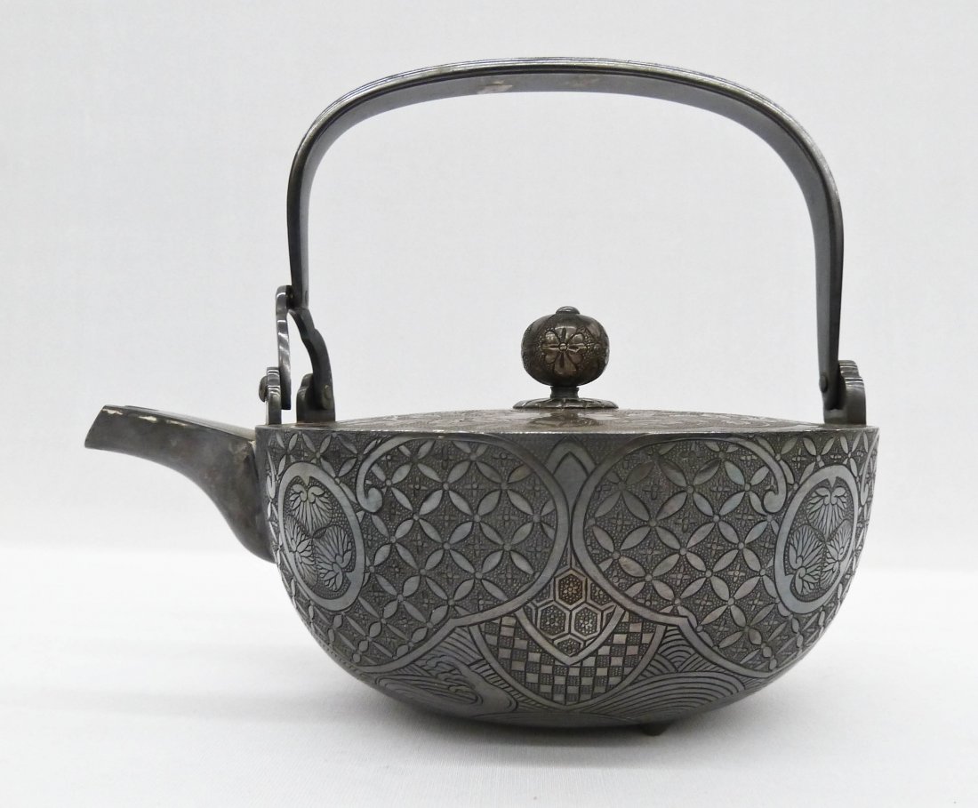 Meiji Japanese Fine Silver Chosi Sake Kettle or: Meiji Japanese Fine Silver Chosi Sake Kettle or Tetsubin Teapot 6.25''x7.75''. Finely engraved design all around the exterior. Unmarked, but tested sterling silver. Weighing 27.3 troy ounces.