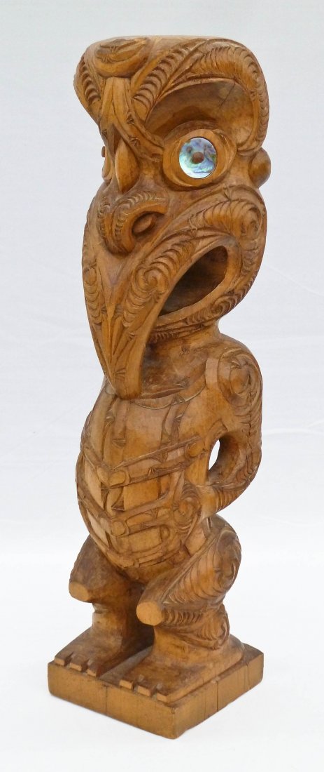 James Rickard (20th/21st Century New Zealand) Maori: James Rickard (20th/21st Century New Zealand) Maori Tekoteko 1969 Carved Tiki God 18''x4.5''x4.5''. Carved wood with mother of pearl inset eyes. Signed on bottom with label on bottom edge. Some cracki