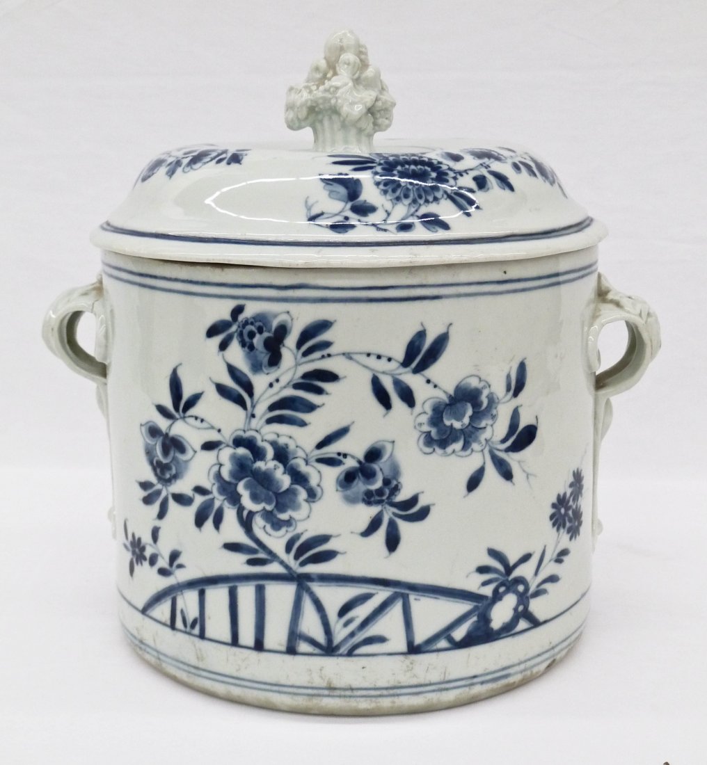 Antique Italian Porcelain Bottle Cooler with Chinese: Antique Italian Porcelain Bottle Cooler with Chinese Style Peony Motif 9.25''x9.75''. 18th century piece with blue and white underglaze blossoming peony flowers. It has an old newspaper article explai