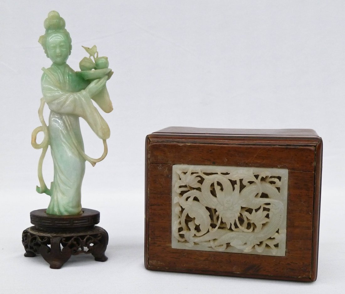 (2) Chinese Carved Jade Pieces. Jadeite Guanyin figure: (2) Chinese Carved Jade Pieces. Jadeite Guanyin figure holding a bowl of fruit 6'' on stand. She is missing part of her scrolling ornament at left. Rosewood box with pale mutton fat pierced jade drago