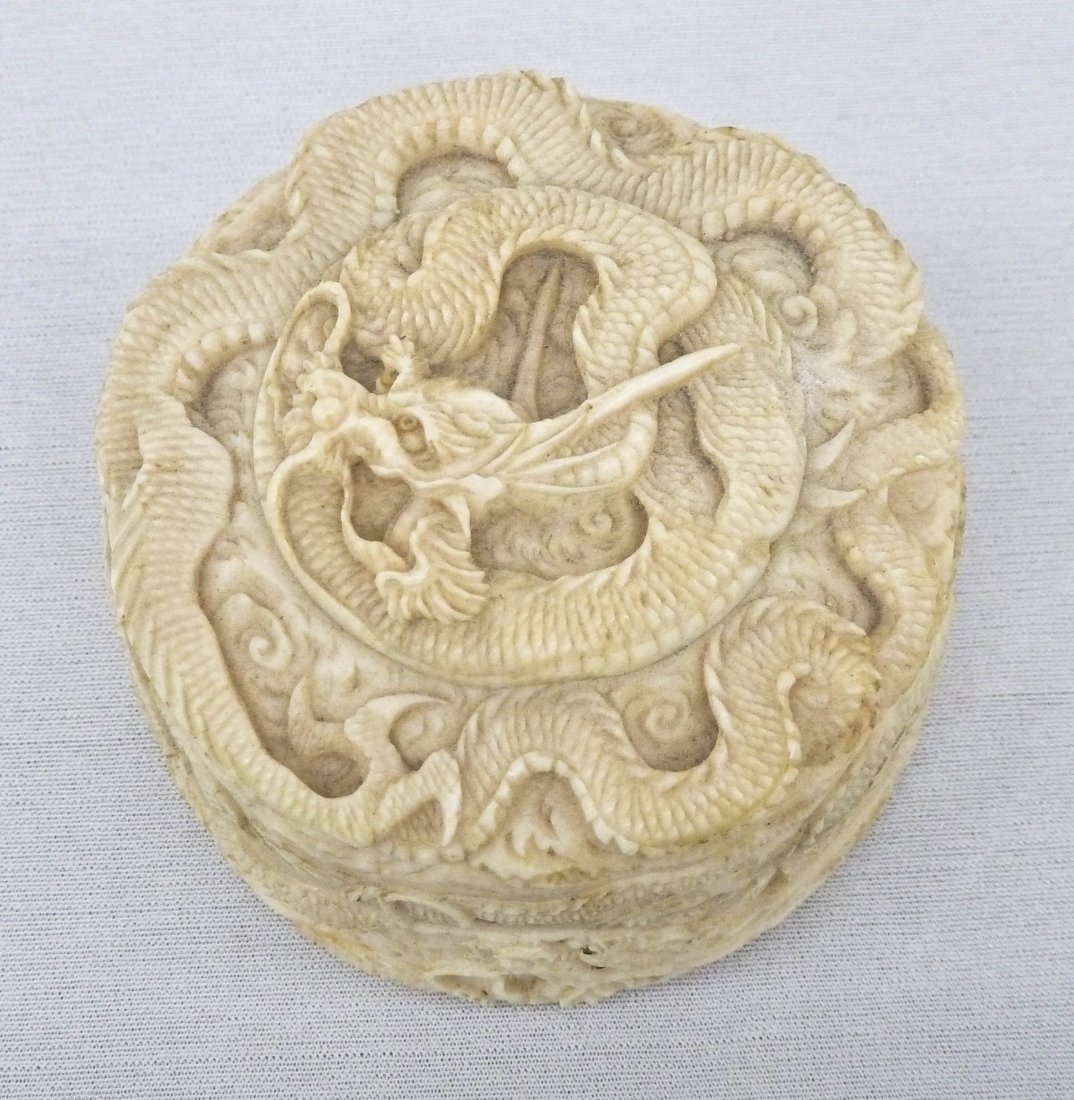 Japanese Ivory Fierce Dragon Box 2.5''x1.5''. Finely: Japanese Ivory Fierce Dragon Box 2.5''x1.5''. Finely carved with fierce coiled dragon in center and another one around sides. Chip to edge. Antique, Meiji period.
