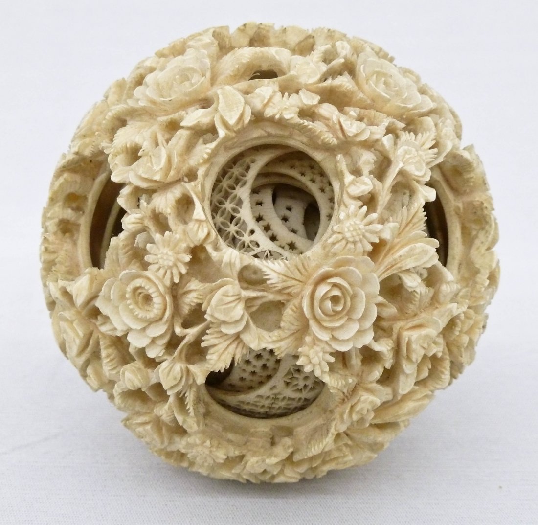 Chinese Floral Ivory Puzzle Ball 3.5''. Finely carved: Chinese Floral Ivory Puzzle Ball 3.5''. Finely carved blossoming flowers with layers of concentric rings. Excellent condition. Antique, Qing dynasty.
