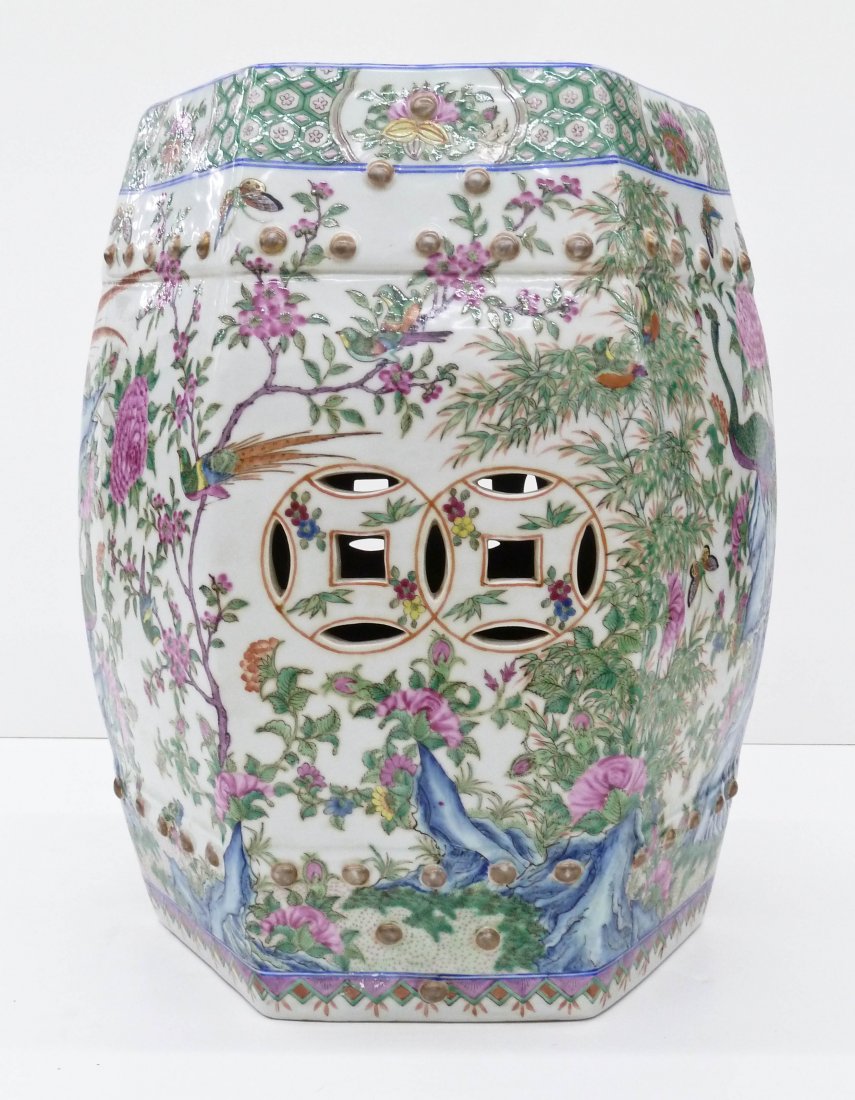 Chinese Famille Rose Peacock Porcelain Garden Seat: Chinese Famille Rose Peacock Porcelain Garden Seat 17.75''x15''. Fine polychrome enameling with a lush landscape with peacock birds, butterflies, and an array of blossoming flowers. Polygon form with 