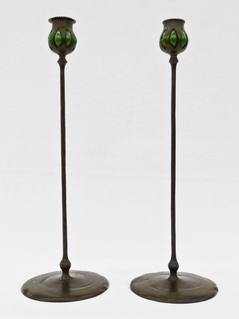 Pair of Tiffany Studio Attributed Bronze & Green Art: Pair of Tiffany Studio Attributed Bronze & Green Art Glass Form 1213 Candlesticks 17.5''x5.75''. Original patina. Each has breakage to the green blown out glass. Missing one bobeche. Both are unmarked