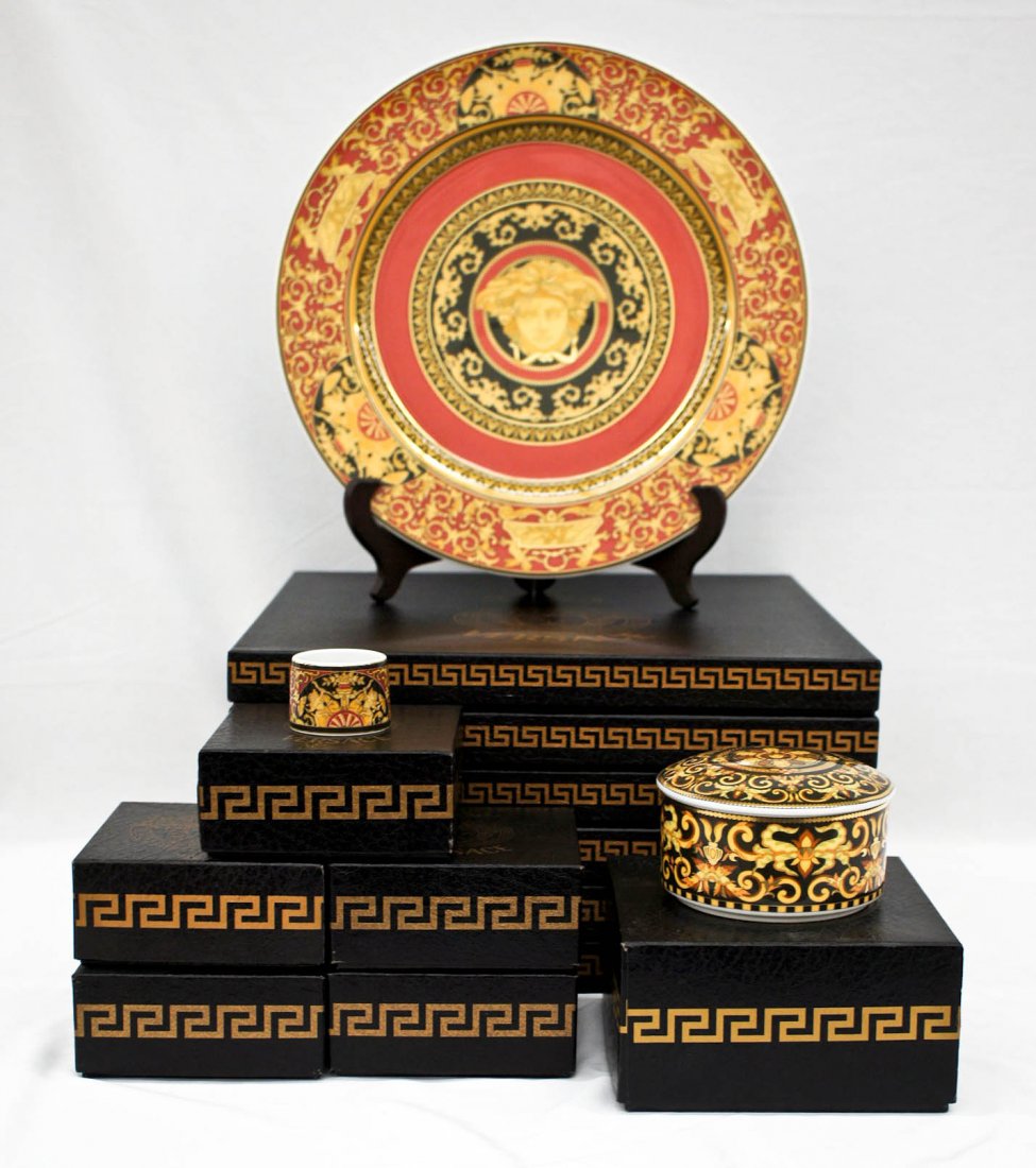 (12) Pieces of Versace Medusa Rosenthal China in: (12) Pieces of Versace Medusa Rosenthal China in Original Boxes. Includes (6) chargers or dinner plates 12'', (5) napkin rings, and (1) Barocco covered box. Excellent condition.