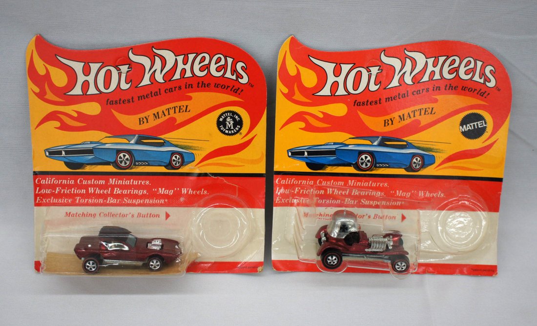 (2) Vintage Hot Wheels Redline Toy Cars in Package.: (2) Vintage Hot Wheels Redline Toy Cars in Package. Includes the Red Baron and The Python. Plastic blisters have been cut and tin buttons have been removed.