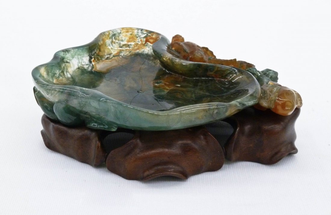 Chinese Finely Carved Moss Agate Coy Fish Brush Washer: Chinese Finely Carved Moss Agate Coy Fish Brush Washer on Stand 3.75''x3''. Relief carved lotus blossom on base with two pierced carved figural coy fish on side. Finely carved rosewood fitted base.