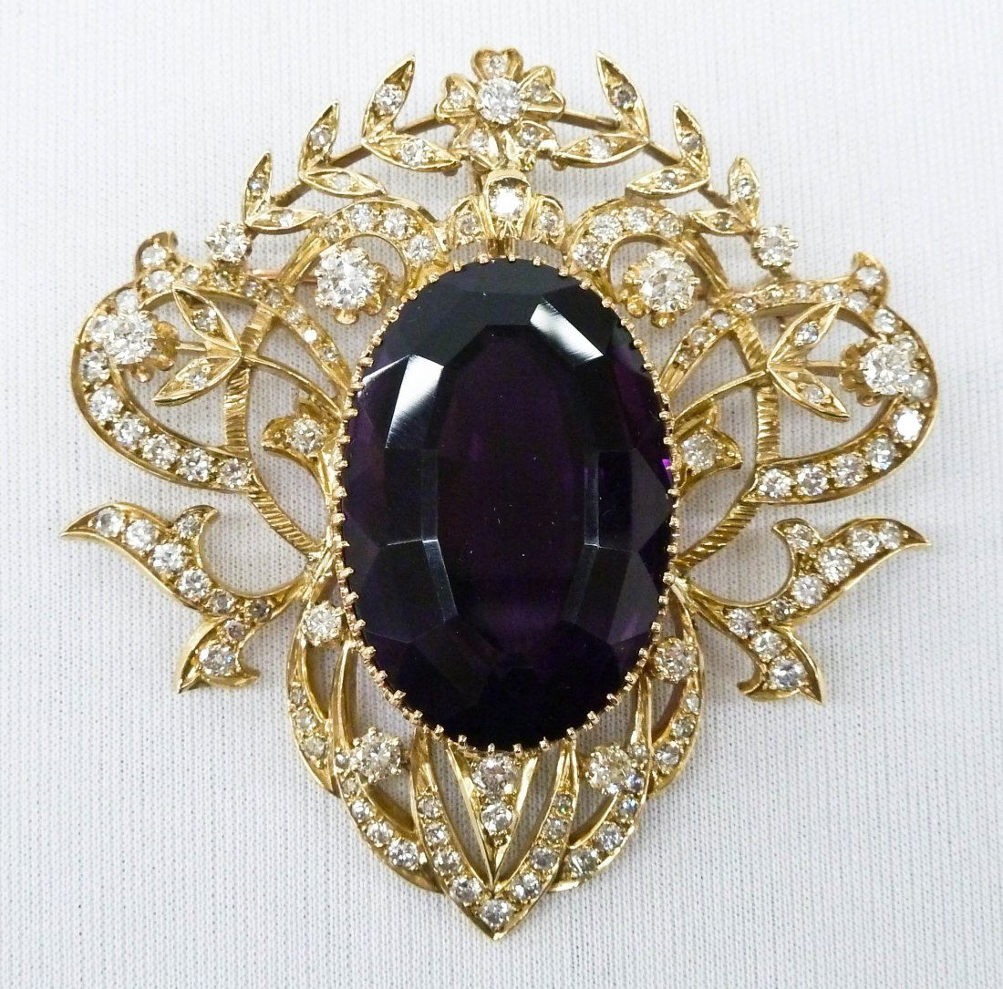 Impressive 69.6ct Oval Amethyst & Diamond 18k Brooch: Impressive 69.6ct Oval Amethyst & Diamond 18k Brooch 2.5''x2.5''. Includes a 69.6 carat oval mixed cut natural amethyst quartz with (124) round cut diamonds of SI2-I1, color I-J grade. Total of 4.64 c