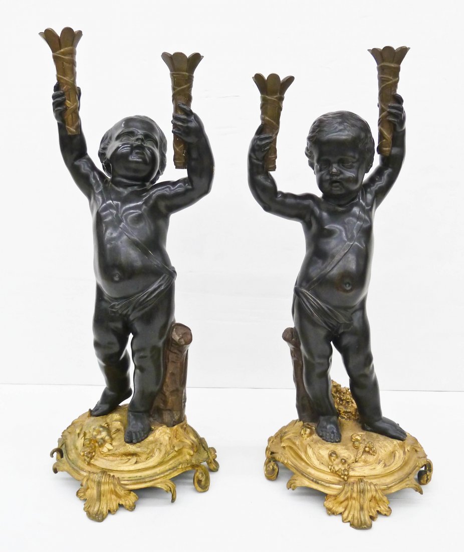 Impressive Pair of French Gilt Bronze Large Figural: Impressive Pair of French Gilt Bronze Large Figural Putti Candelabras 29''x11'' Each. Both are 2-light floor candlesticks with ormolu bases. Unmarked. 19th century.