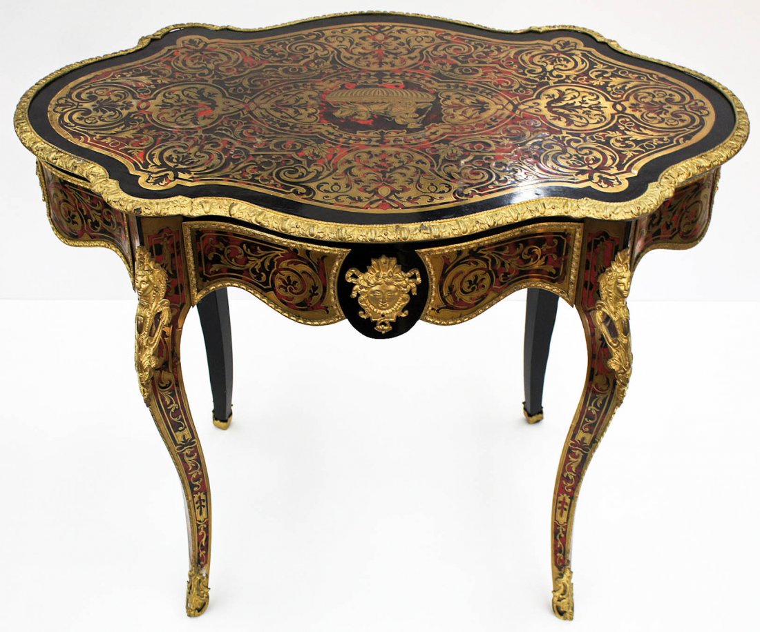 A Fine French Boulle Turtle Top Occasional Table or: A Fine French Boulle Turtle Top Occasional Table or Desk 30''x39.5''x26.25''. Figural ormulu mounts with chariot scene in central medallion. It has a drawer on one side. Excellent condition. 19th cent