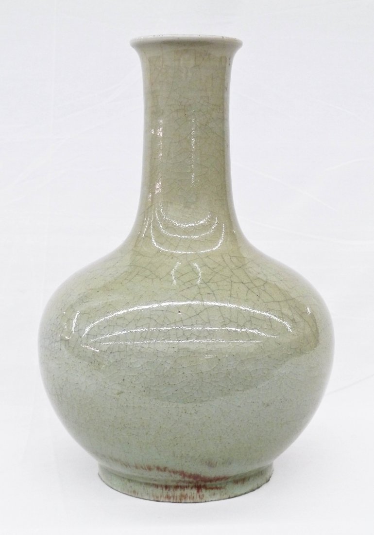 Antique Chinese Celadon & Sang de Boeuf Crackle Glaze: Antique Chinese Celadon & Sang de Boeuf Crackle Glaze Porcelain Bottle Vase 11.75''x7.5''. Small splash of oxblood glaze near foot. Various chips around bottom edge. Crack to top rim. 19th century or 