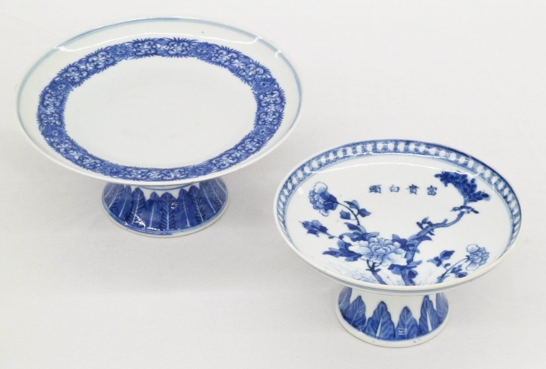 (2) Antique Chinese Blue & White Fine Porcelain Stem: (2) Antique Chinese Blue & White Fine Porcelain Stem Cups or Compotes. Larger piece measures 3.25''x7'' with a scrolling lotus blossom blue underglaze design. Smaller piece depicts blossoming peony fl