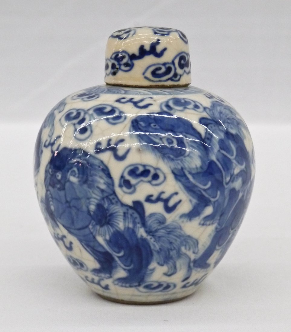 Old Chinese Miniature Blue & White Foo Dog Ginger Jar: Old Chinese Miniature Blue & White Foo Dog Ginger Jar 3''x2.5''. Crackle glaze with five blue and white underglaze foo lions in various positions. It bears a six character blue underglaze Kangxi mark.