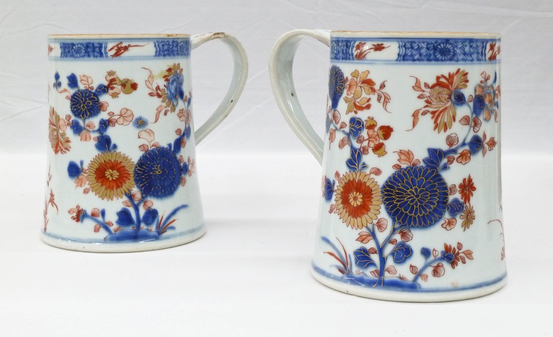 Pair Antique Chinese Export Imari Porcelain Tankards or: Pair Antique Chinese Export Imari Porcelain Tankards or Mugs 6''x6'' Each. Blue underglaze blossoming chrysanthemum flowers with red and gilt over work. Slight glaze chips to one handle. 18th century.