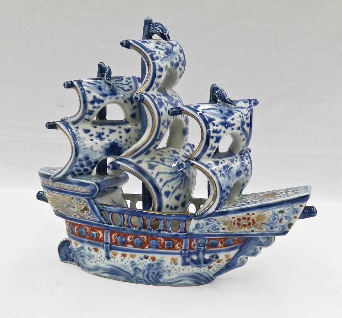 Antique Japanese Imari Schooner Ship Porcelain Model: Antique Japanese Imari Schooner Ship Porcelain Model 9.25''x10.5''. Blue underglaze waves and phoenix decoration on sails. Fine gilt work on hull with dragon design. Small old professional repair to s