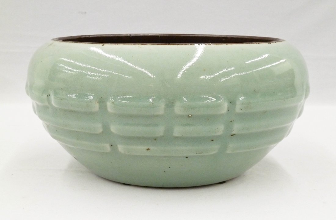 Antique Chinese Longquan Celadon Trigram Porcelain Bowl: Antique Chinese Longquan Celadon Trigram Porcelain Bowl 4.5''x9.75''. Exterior has the eight buddhist trigrams molded in relief. Hairline crack at top rim and glaze crazing on exterior. Qing dynasty.