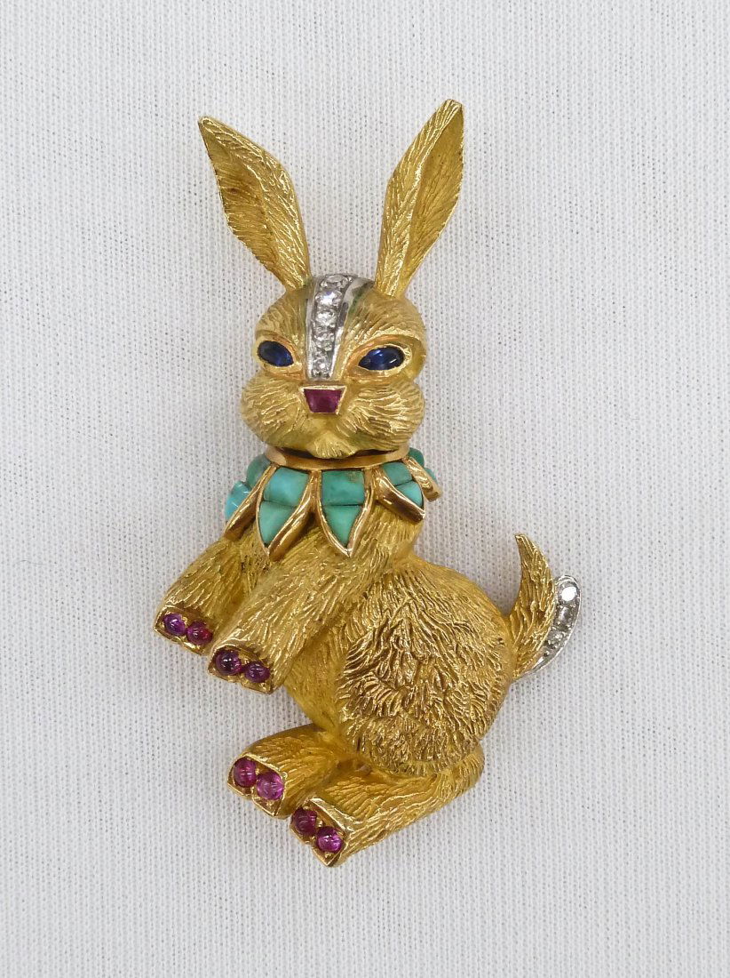 Vintage Boucheron Paris 18k Jeweled Rabbit Brooch or: Vintage Boucheron Paris 18k Jeweled Rabbit Brooch or Fur Clip 2''x1.25''. Set with diamonds, rubies, a turquoise collar, and sapphire eyes. Clearly marked on verso and tested 18k gold. Weighing a tota