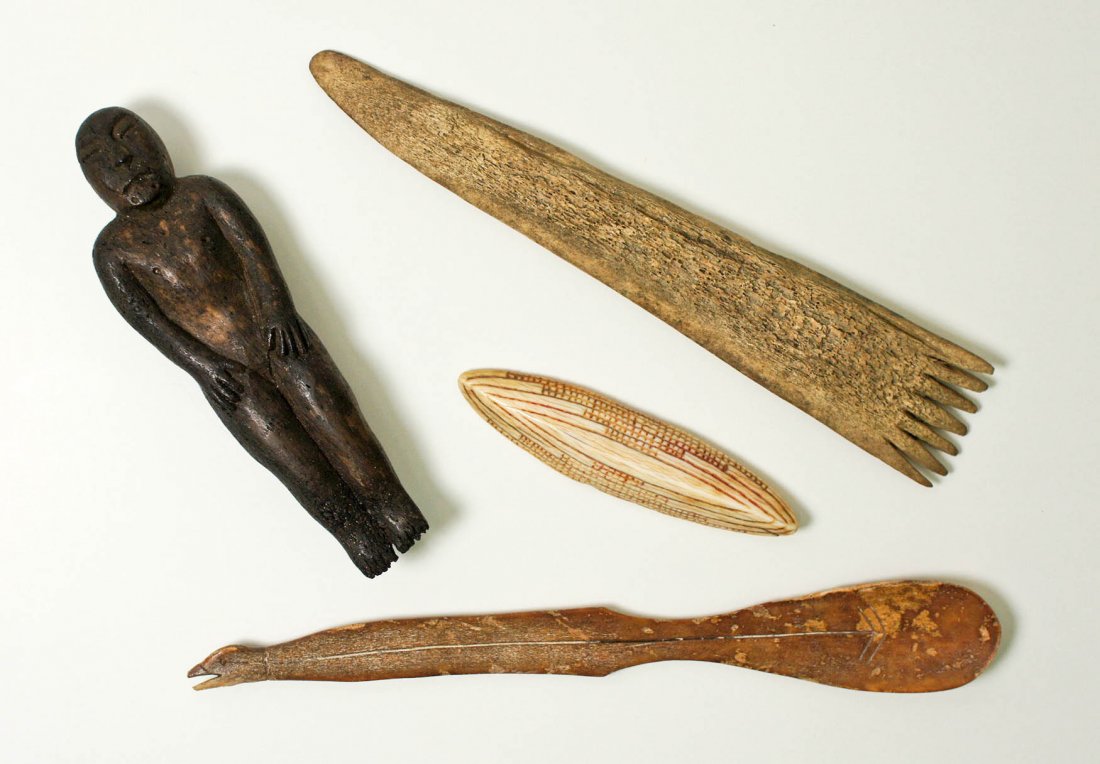 4pc Old Eskimo Native Implements. Includes a carved: 4pc Old Eskimo Native Implements. Includes a carved fossilized ivory effigy spoon 7''x1, a whale bone human figure 4.5''x1.5'', whale bone comb 6.5''x1.25'', scrimshawed ivory button 3.25''x.75''. Pie
