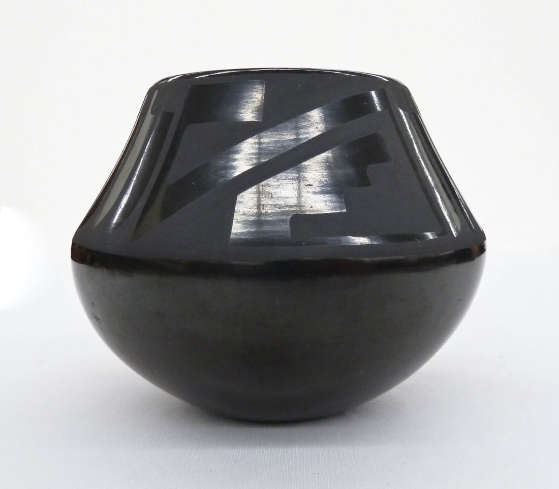 Maria & Santana Martinez (1887-1980 & 1909-2002) San: Maria & Santana Martinez (1887-1980 & 1909-2002) San Ildefonso Blackware Feather Bowl 4''x5''. Repeating feather design around exterior. Signed ''Maria + Santana'' in script. A few small exterior scuf