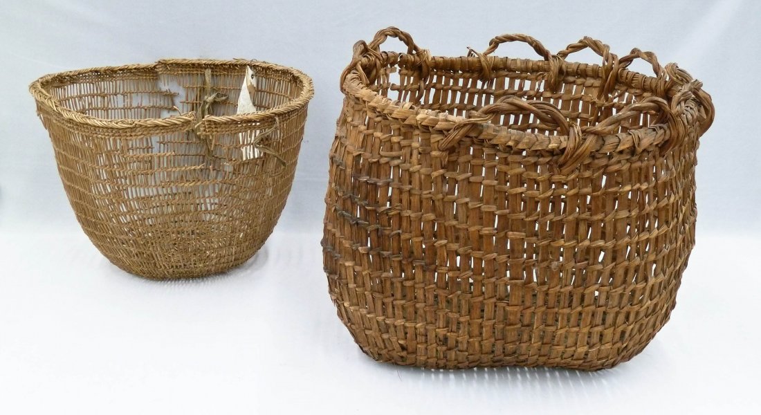2pc Old Northwest Coast Clam Gathering Indian Baskets.: 2pc Old Northwest Coast Clam Gathering Indian Baskets. Larger handled basket measures 13.5''x16'' while smaller is 11''x16''. Large basket has some small holes, while smaller is in as-is condition. Ma