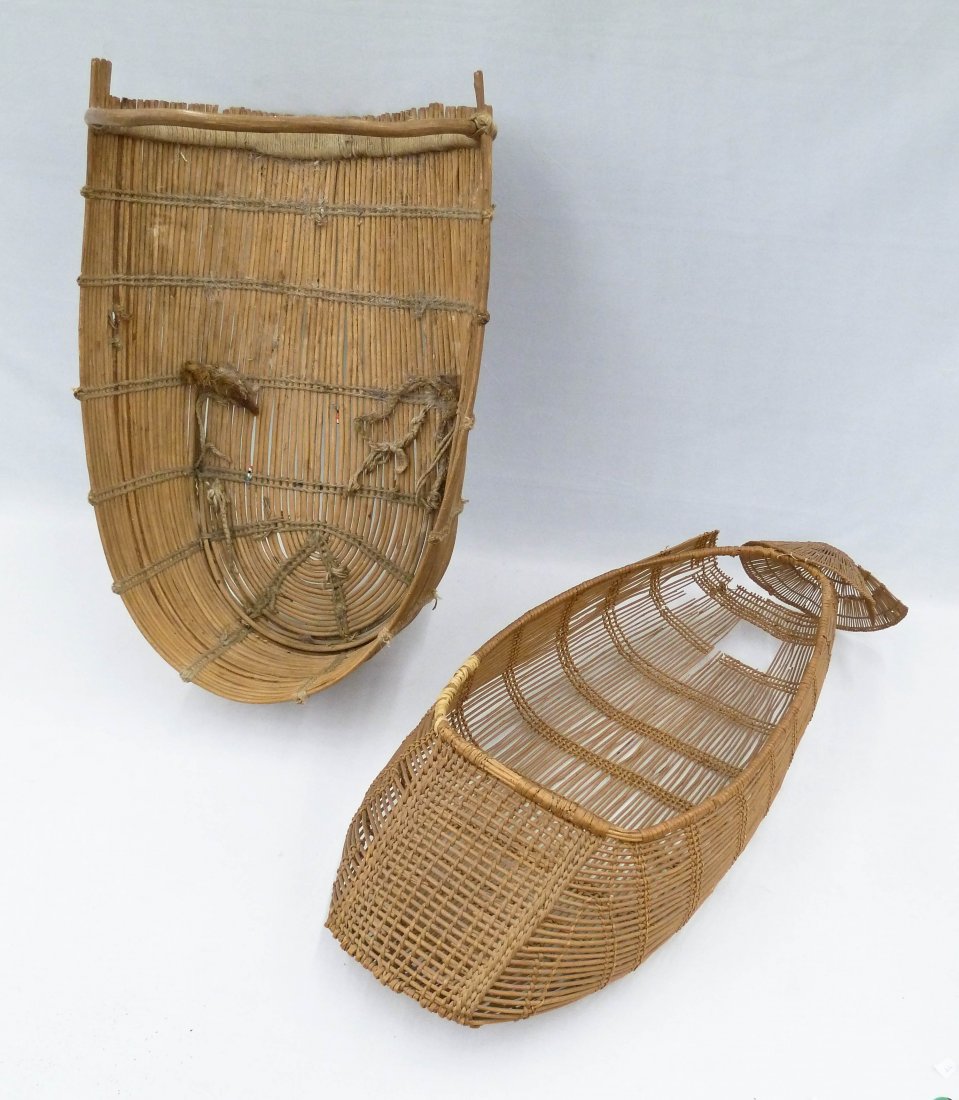 2pc Old Indian Basketry Cradles. First is a Hupa basket: 2pc Old Indian Basketry Cradles. First is a Hupa basket cradle measuring 5.5''x23.5''x11.5'' and second is plateau measuring 11.5''x21''x14.5''. Hupa basket has breaks.