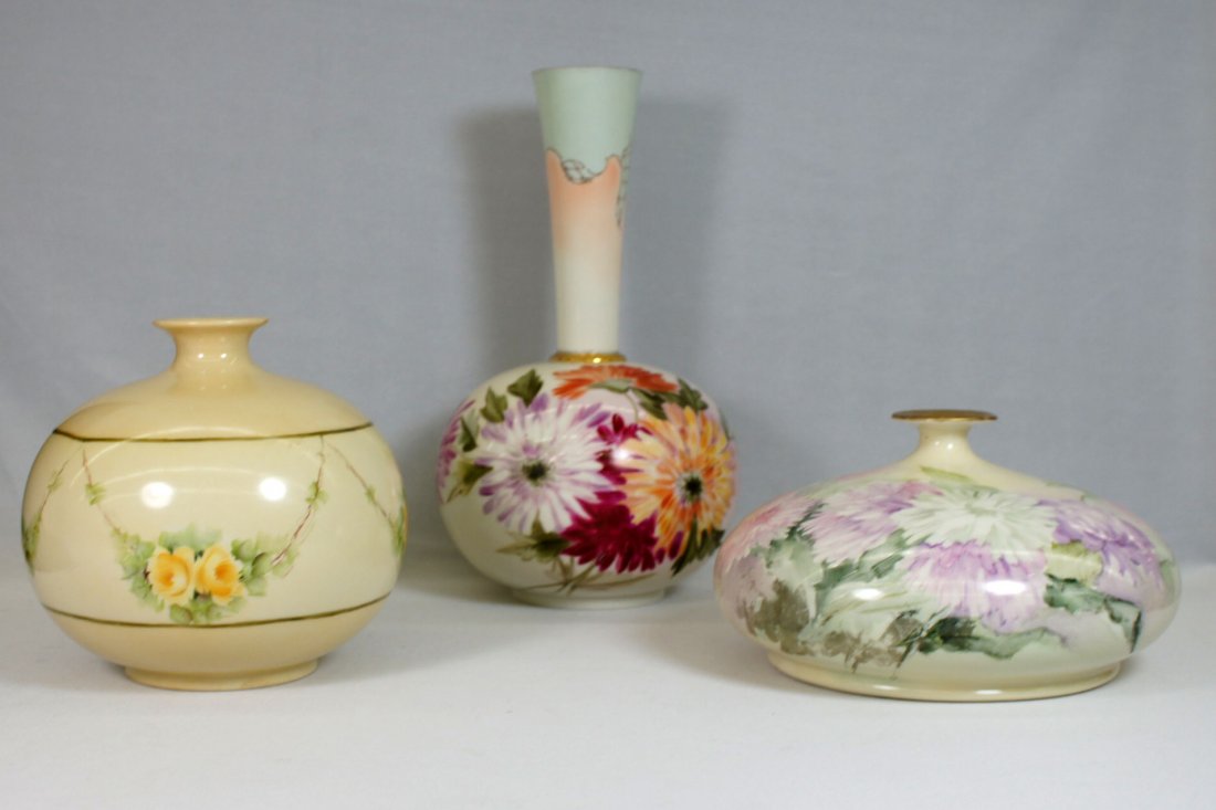 Three Willets Belleek hand painted floral vases. This: Three Willets Belleek hand painted floral vases. This group includes a squat vase measuring 4.25'' x 7.5'', a round vase 6'' x 6'' and a trumpet vase 10.5'' tall. All are in excellent condition.