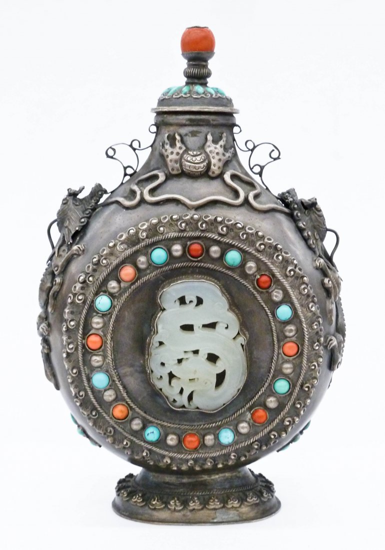 Antique Chinese Mongolian Silver Moon Flask Covered: Antique Chinese Mongolian Silver Moon Flask Covered Vase with Inset Jade Pendants 8''x5.25''. Figural opposing dragons on shoulder with central flaming pearl. Finely carved pale celadon jade dragon pe