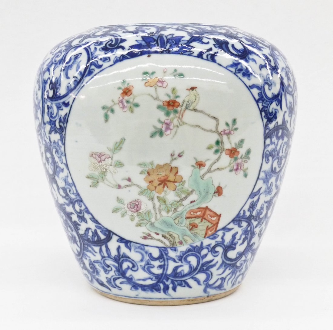 Antique Chinese Famille Rose Porcelain Vase: Antique Chinese Famille Rose Porcelain Vase 9.25''x9.25''. Stark scrolling blossoming lotus flowers in blue and white underglaze. It has two polychrome panels of a single bird within landscape. Gilt d