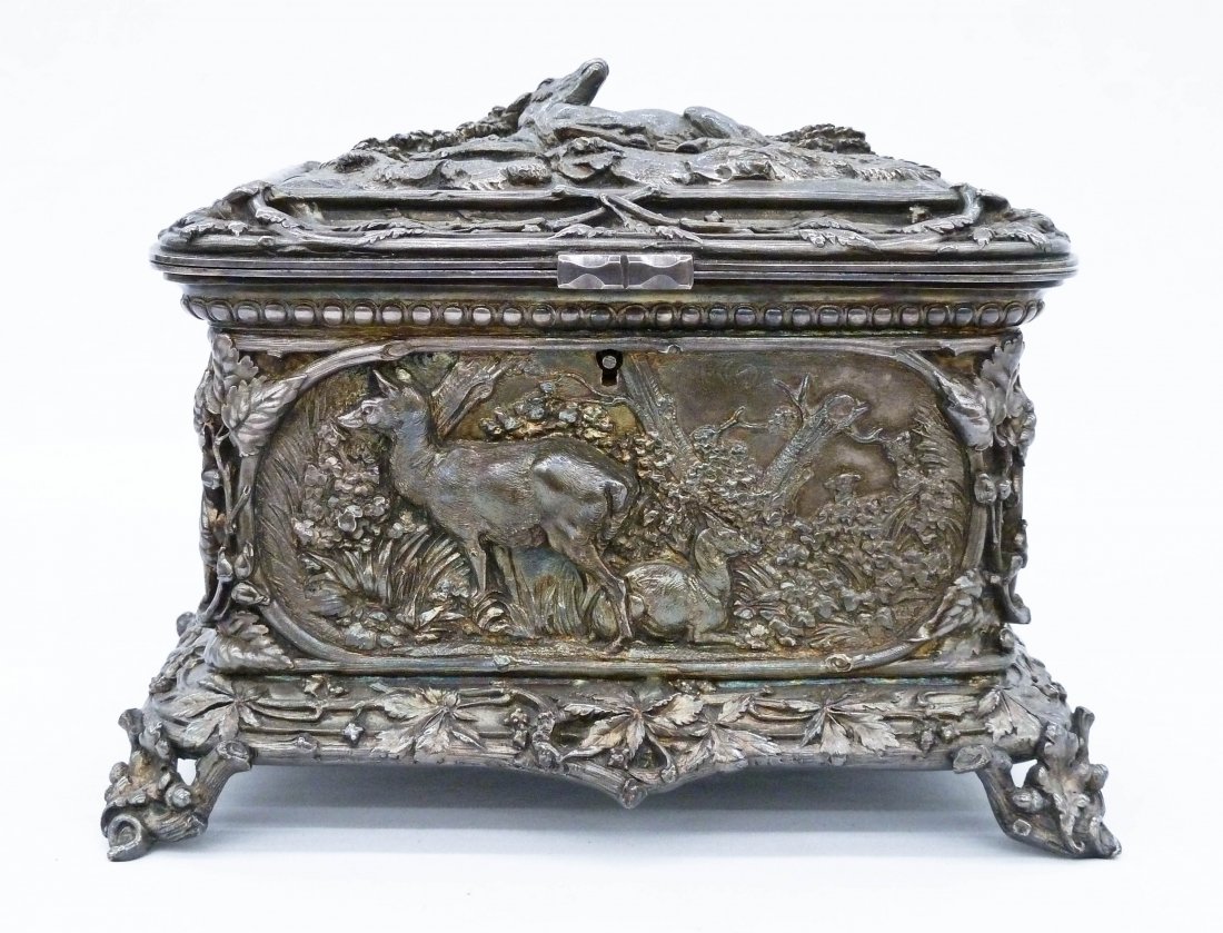 Antique French Silverplated Hunting Themed Jewelry: Antique French Silverplated Hunting Themed Jewelry Casket 5.25''x7.5''x 5.25''. Silver over copper body with relief stag and deer panels. Signed L. Oudry Pre Editeur on side. Excellent condition with 
